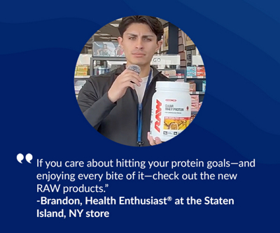 Man holding microphone and protein powder tub