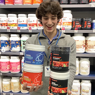 health enthusiast holding supps