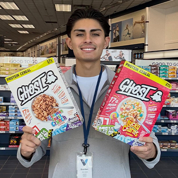 Brandon Gallego holding a ghost cereals
