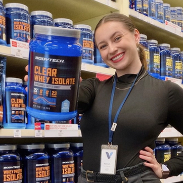 Hannah Leal holding a BodyTech's new Clear Whey Isolate container